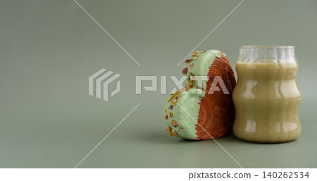 Nutrient-rich matcha drink with Green latte Matcha tea coffee with Delightful and vibrant heartshaped pastry croissant treat, beautifully topped with colorful frosting nut galore. Mock up template 140262534
