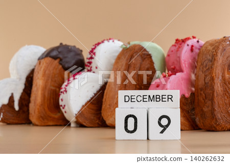 9 December calendar day celebration National Pastry Day Heart shaped different variety flavor croissants on beige background with copy space. Puff pastry new trendy sweet dessert bakery. Creamy dough 9 December calendar day celebration National Pastry Day Heart shaped different variety flavor croissants on beige background with copy space. Puff pastry new trendy sweet dessert bakery. Creamy dough 140262632