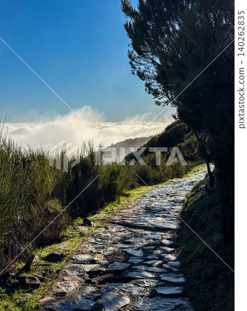 Stone hiking path above the clouds on Vereda do Pico Ruivo trail in Madeira Portugal Stone hiking path above the clouds on Vereda do Pico Ruivo trail in Madeira Portugal 140262835