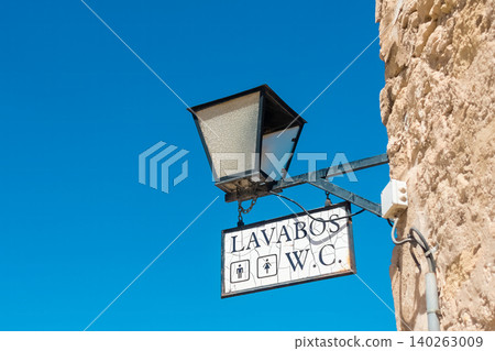 Public Restroom Sign for Men and Women on Tourist Street Public Restroom Sign for Men and Women on Tourist Street 140263009