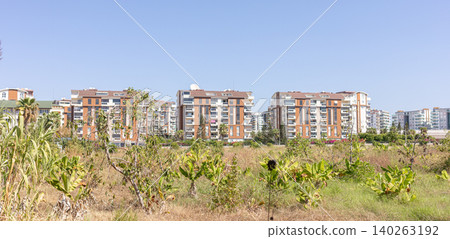 Modern residential buildings of Avsallar, Turkey, with green landscape in urban area Modern residential buildings of Avsallar, Turkey, with green landscape in urban area 140263192