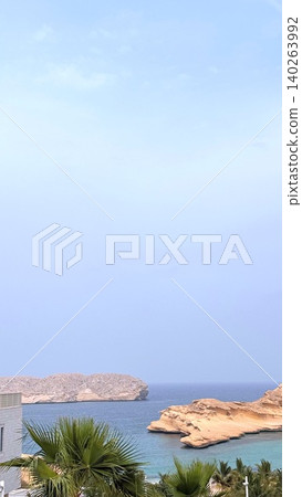 Heavy Cloudy Before Rain Coastal View Travel Destination With Sea And Rocky Islands Surrounded By Palm Trees, Sea Shows Calm Horizon And Sea Creates Serene Atmosphere In Scenic Coastal Landscape Heavy Cloudy Before Rain Coastal View Travel Destination With Sea And Rocky Islands Surrounded By Palm Trees, Sea Shows Calm Horizon And Sea Creates Serene Atmosphere In Scenic Coastal Landscape 140263992