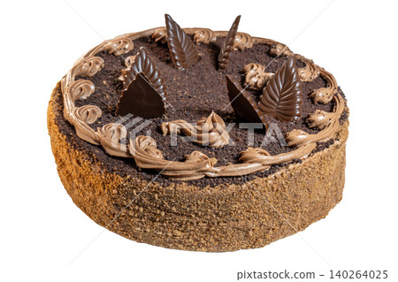 Rich chocolate cake with frosting swirls and decorative leaf garnish Rich chocolate cake with frosting swirls and decorative leaf garnish 140264025