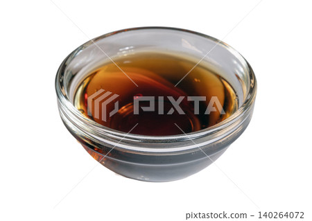Clear glass bowl filled with glossy dark brown condiment sauce Clear glass bowl filled with glossy dark brown condiment sauce 140264072