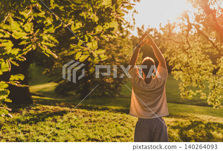 Man Doing Yoga Stretch in Green Park Man Doing Yoga Stretch in Green Park 140264093