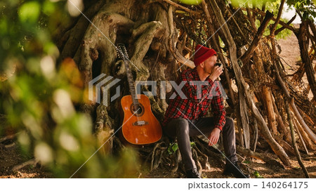 Musician Enjoying Creative Escape Into Nature Musician Enjoying Creative Escape Into Nature 140264175