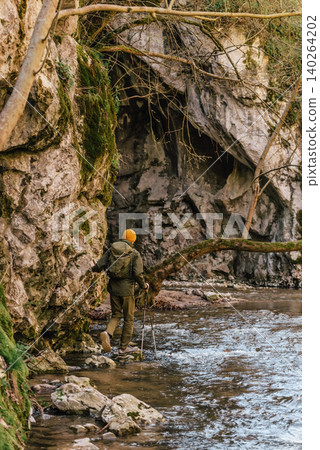 Male Explorer Crossing Forest River Male Explorer Crossing Forest River 140264202