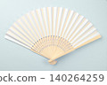 Folding paper bamboo fan on a gray background. Chinese or Japanese blank fan for sublimation. 140264259