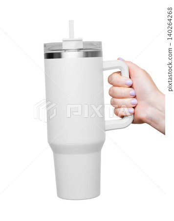 Female Hand Holding 40 oz white tumbler. Tumbler With Handle, Travel Mug Straw Covers Cup with Lid Female Hand Holding 40 oz white tumbler. Tumbler With Handle, Travel Mug Straw Covers Cup with Lid 140264268