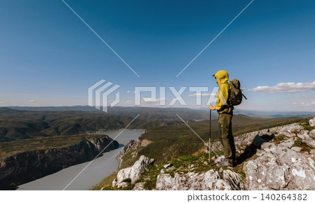 Hiker Overlooking Danube River from Mountain Peak Hiker Overlooking Danube River from Mountain Peak 140264382
