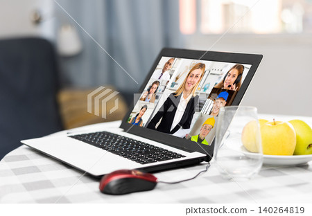 Laptop with image of people participating in video conference closeup Laptop with image of people participating in video conference closeup 140264819