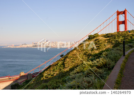 Golden Gate Bridge hillside path with San Francisco skyline across bay 140264970