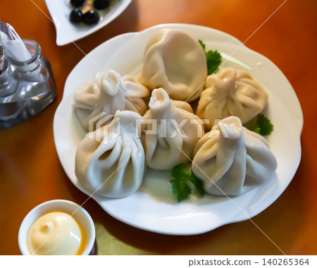 Khinkali - the meat dumplings from Georgian cuisine Khinkali - the meat dumplings from Georgian cuisine 140265364
