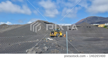 Special equipment on the territory developing flows of solidified lava after a volcanic eruption. High quality photo Special equipment on the territory developing flows of solidified lava after a volcanic eruption. High quality photo 140265400