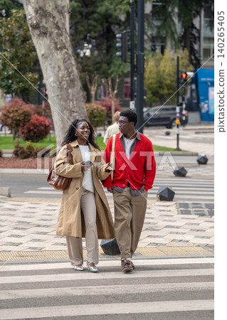 Fashionable cheerful african american couple man and woman close friends meeting for walk in town. Fashionable cheerful african american couple man and woman close friends meeting for walk in town. 140265405