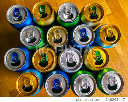 Colorful used metal beverage cans close-up. Concept of collection, recycling, and reuse of packaging. High quality photo Colorful used metal beverage cans close-up. Concept of collection, recycling, and reuse of packaging. High quality photo 140265447