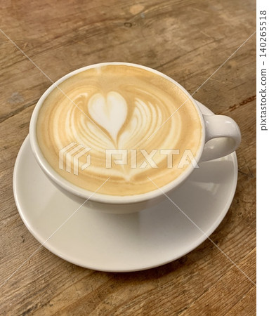 A beautiful heart-shaped latte poured into a white cup. A beautiful heart-shaped latte poured into a white cup. 140265518