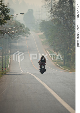Northern Thailand suffering from dry season and heavy mountain fires, smog and smoke covering roads. Northern Thailand suffering from dry season and heavy mountain fires, smog and smoke covering roads. 140265676
