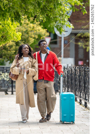 Happy relaxed african american man and woman couple travelers exploring new city on weekend trip. Happy relaxed african american man and woman couple travelers exploring new city on weekend trip. 140265762