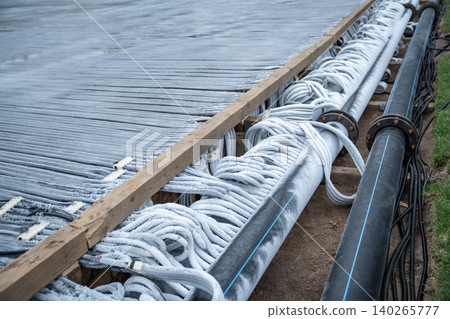 Pouring with frozen water of plastic conduit and elastic pipeline of cooling engineering system Pouring with frozen water of plastic conduit and elastic pipeline of cooling engineering system 140265777