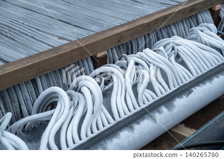 Ice rink cooling system technology : plastic pipes covered with ice for frozen water maintenance 140265780