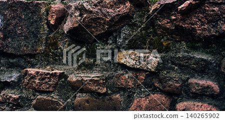 Ancient granite wall made of old stones, copper color Ancient granite wall made of old stones, copper color 140265902