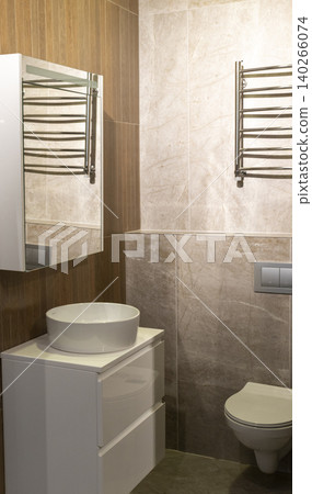Contemporary Restroom Decor Featuring Ceramic Sink and Textured Geometric Wall 140266074