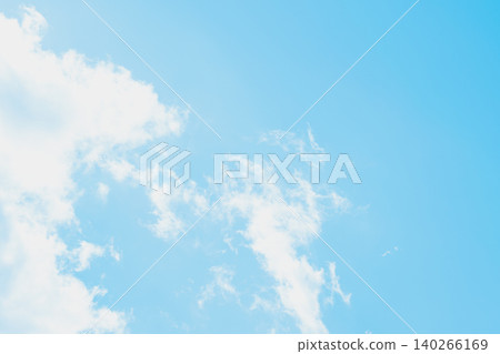 Panoramic view of a clear azure sky with wispy cirrus clouds. Soft blue gradients and airy textures create a vast minimalist backdrop with extensive copy space for web Panoramic view of a clear azure sky with wispy cirrus clouds. Soft blue gradients and airy textures create a vast minimalist backdrop with extensive copy space for web 140266169