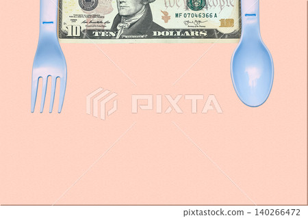 Leave a tip as thank you.Ten dollars bill and plastic fork,spoon 140266472