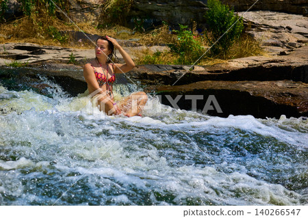 Cute woman in swimwearin mountain river.Relax and resting Cute woman in swimwearin mountain river.Relax and resting 140266547