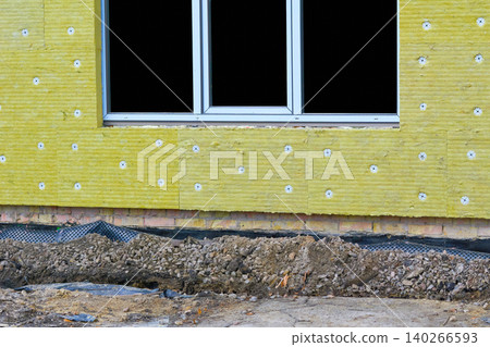 Construction site.Thermal insulation panels on wall with window Construction site.Thermal insulation panels on wall with window 140266593