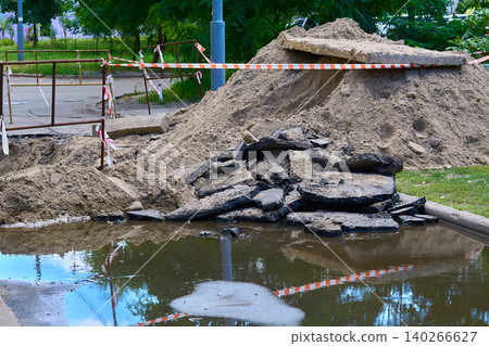 Emergency fencing for sewer pipe break in middle of road Emergency fencing for sewer pipe break in middle of road 140266627