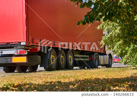 Delivery freights. Heavy red trailer for long distance transportation Delivery freights. Heavy red trailer for long distance transportation 140266633