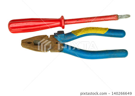 Screwdriver and pliers from the home shed for repair Screwdriver and pliers from the home shed for repair 140266649
