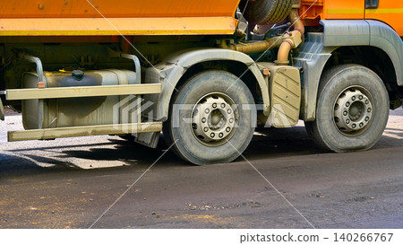 Front wheels and fuel tank of a powerful tractor lorry truck 140266767