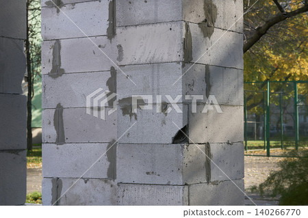Construction.Support pillar made of brick blocks for building wall Construction.Support pillar made of brick blocks for building wall 140266770