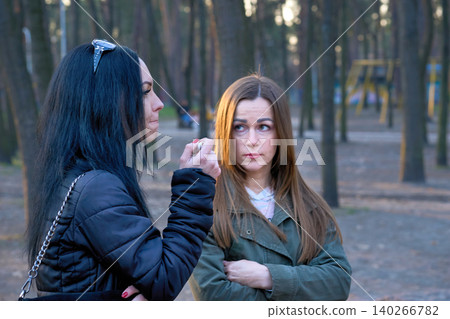 Women talking.Two young women girlfriends,serious conversation discussion Women talking.Two young women girlfriends,serious conversation discussion 140266782