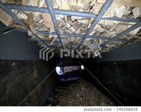 Wood Chips Placed Neatly on a Grate in a Storage Area for Processing Wood Chips Placed Neatly on a Grate in a Storage Area for Processing 140266838