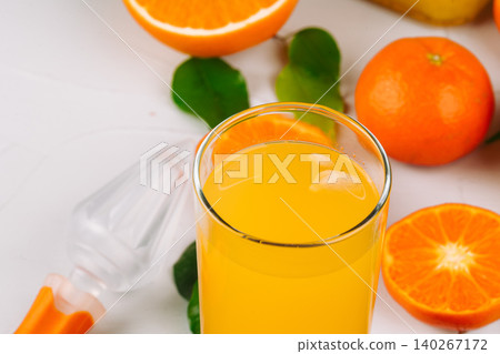 Glass of orange juice and orange slices Glass of orange juice and orange slices 140267172