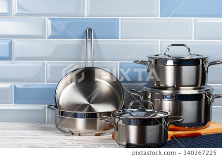 Set of aluminum cookware on kitchen counter Set of aluminum cookware on kitchen counter 140267225