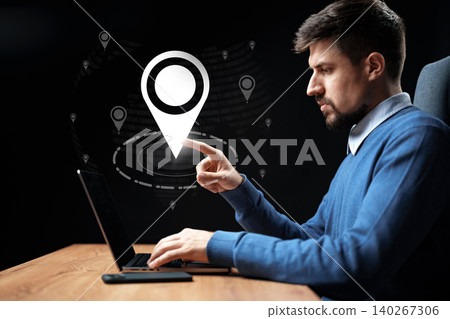Planning a taxi route on a map using a laptop for travel Planning a taxi route on a map using a laptop for travel 140267306