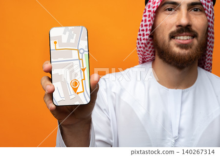 Man shows smartphone with map for taxi location in urban area 140267314