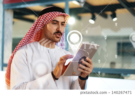 Man using tablet to plan taxi route on map in a modern setting Man using tablet to plan taxi route on map in a modern setting 140267471