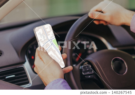 Driver uses smartphone map to find taxi location during urban travel Driver uses smartphone map to find taxi location during urban travel 140267545