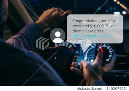 Received scam message while driving at night with a phone in hand Received scam message while driving at night with a phone in hand 140267622