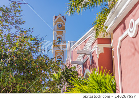 Historic courtyard details, balconies and tropical plants show colorful Mexican architecture, heritage tourism and travel background concept Historic courtyard details, balconies and tropical plants show colorful Mexican architecture, heritage tourism and travel background concept 140267657
