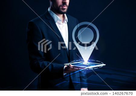 Man holding tablet displaying a map with a travel route and location marker for taxi navigation Man holding tablet displaying a map with a travel route and location marker for taxi navigation 140267670