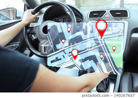 Driving a taxi using a map to follow travel routes in a city Driving a taxi using a map to follow travel routes in a city 140267687