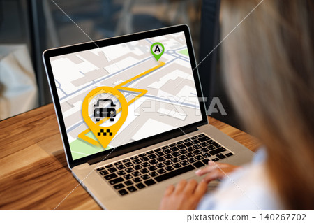 Map showing taxi location and route for city travel on a laptop screen Map showing taxi location and route for city travel on a laptop screen 140267702