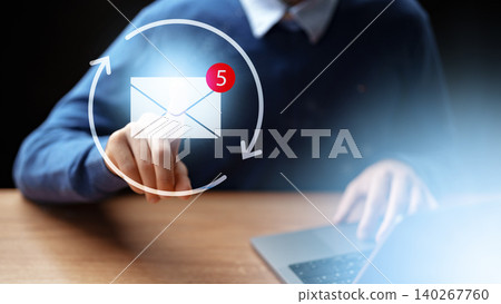 User checks email notifications on laptop while touching screen with notification symbol User checks email notifications on laptop while touching screen with notification symbol 140267760